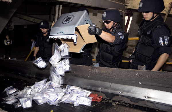 Police burn more than 20 kilograms of illegal drugs in Wuxi, Jiangsu province, on Thursday. The drugs included heroin, methamphetamine and marijuana. Provided To China Daily