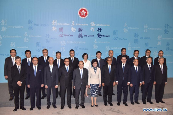 The Hong Kong Special Administrative Region (HKSAR)'s fifth-term chief executive Lam Cheng Yuet-ngor (C front) and principal officials of the fifth term government of the HKSAR pose for group pictures during a press conference in south China's Hong Kong, June 21, 2017. (Xinhua/Wang Xi)