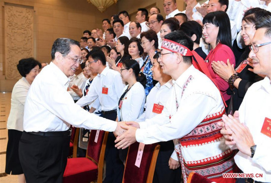 Yu Zhengsheng (L front), a member of the Standing Committee of the Political Bureau of the Communist Party of China (CPC) Central Committee and chairman of the National Committee of the Chinese People's Political Consultative Conference, meets with the CPC members whose ancestral homes were in Taiwan, in Beijing, capital of China, June 21, 2017. (Xinhua/Rao Aimin)