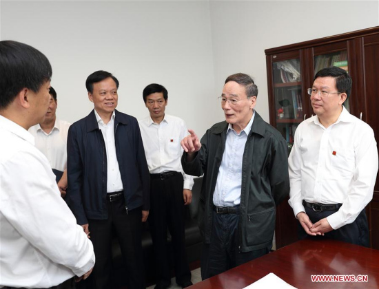 Wang Qishan (2nd R), head of the Communist Party of China (CPC) Central Commission for Discipline Inspection, talks with supervisory officials at provincial anti-graft agency in Guiyang, southwest China's Guizhou Province, June 21, 2017. (Xinhua/Wang Ye)