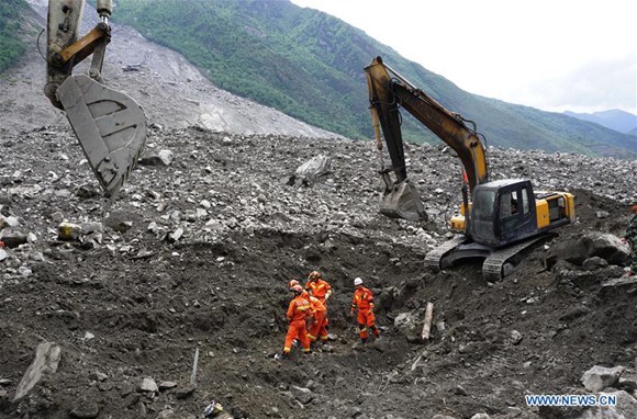 Rescuers search for survivors after a landslide in Xinmo Village of Maoxian County, Tibetan and Qiang Autonomous Prefecture of Aba, southwest China's Sichuan Province, June 25, 2017. Fifteen people had been taken off the list of missing people after the landslide in Sichuan early Saturday, leaving 93 still missing. (Xinhua/Jiang Hongjing)