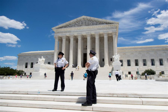 U.S. Supreme Court police officers stand outside the Supreme Court in Washington D.C., the United States, on June 26, 2017. (Xinhua/Ting Shen)