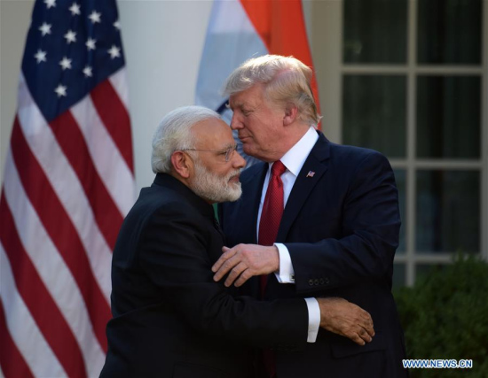 U.S. President Donald Trump (R) and Indian Prime Minister Narendra Modi hug after giving joint statements at the White House in Washington D.C., the United States, June 26, 2017. (Xinhua/Yin Bogu)