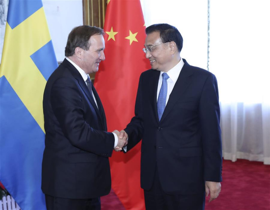 Chinese Premier Li Keqiang (R) holds talks with Swedish Prime Minister Stefan Lofven, who is attending the Annual Meeting of the New Champions 2017, also known as Summer Davos, in Dalian, coastal city of northeast China's Liaoning Province, June 27, 2017. (Xinhua/Pang Xinglei)