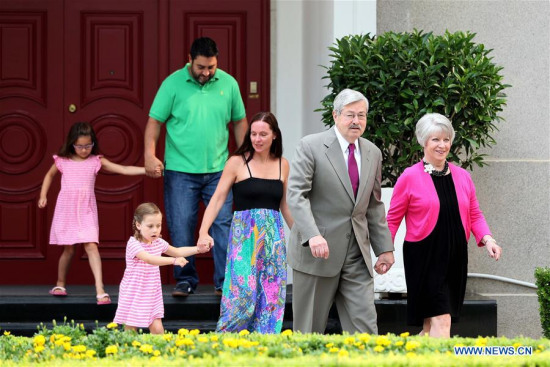U.S. Ambassador to China Terry Branstad (2nd R) walks with his family members to meet with the media at his residence in Beijing, capital of China, June 28, 2017. (Xinhua/Zhang Yuwei)