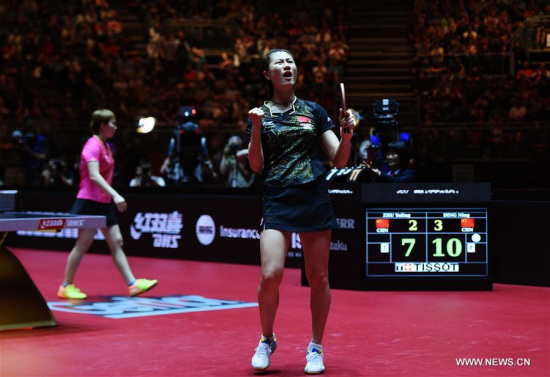Ding Ning (R) of China celebrates victory after the women's singles final match against her compatriot Zhu Yuling at the 2017 World Table Tennis Championships in Dusseldorf, Germany, June 4, 2017. (Xinhua/Tao Xiyi)
