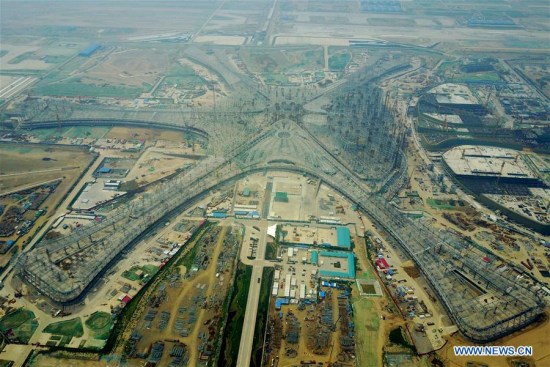 Aerial photo taken on June 30, 2017 shows the terminal of the Beijing new airport is under construction in the southern Daxing District of Beijing, capital of China. The steel rack of the terminal was completed Friday. And the new airport is expected to be completed in 2019. (Xinhua/Zhang Chenlin)