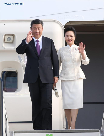 Chinese President Xi Jinping and his wife Peng Liyuan wave upon their arrival in Berlin, Germany, July 4, 2017. Xi arrived here on Tuesday for his second state visit to Germany. (Xinhua/Yao Dawei)