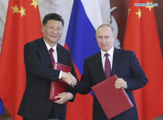 Chinese President Xi Jinping and his Russian counterpart Vladimir Putin attend a signing ceremony after their talks in Moscow, Russia, July 4, 2017. (Xinhua/Xie Huanchi)