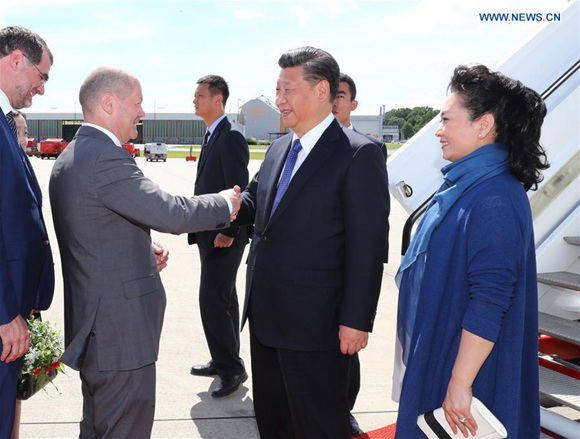 Chinese President Xi Jinping and his wife Peng Liyuan arrive at the airport in Hamburg, Germany, July 6, 2017. Xi Jinping arrived in the northern German city of Hamburg Thursday for the 12th Group of 20 (G20) Summit. (Xinhua/Xie Huanchi)