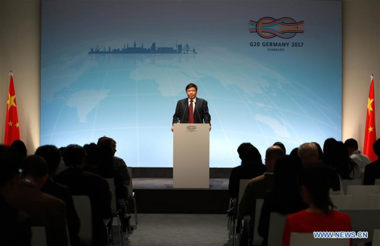 Chinese Vice Minister of Finance Zhu Guangyao addresses a news briefing prior to G20 Summit in Hamburg, Germany, on July 6, 2017. (Xinhua/Luo Huanhuan)