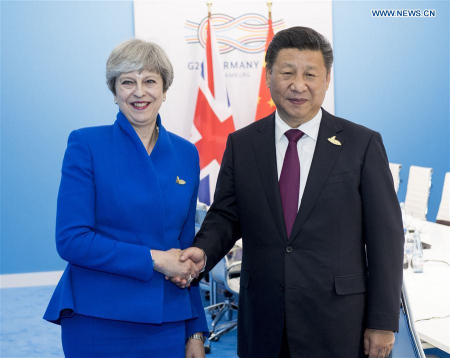 Chinese President Xi Jinping meets with British Prime Minister Theresa May in Hamburg, Germany, July 7, 2017. (Xinhua/Li Xueren)