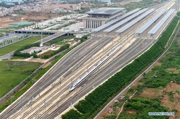 A bullet train leaves the Baoji South Railway Station in Baoji, northwest China's Shaanxi Province, July 9, 2017. The high speed railway line linking Baoji and Lanzhou, capital of northwest China's Gansu Province, was officially put into operation on Saturday. It will cut travel time from Lanzhou to Xi'an, capital of Shaanxi, from 6 to 3 hours. (Xinhua/Tang Zhenjiang)