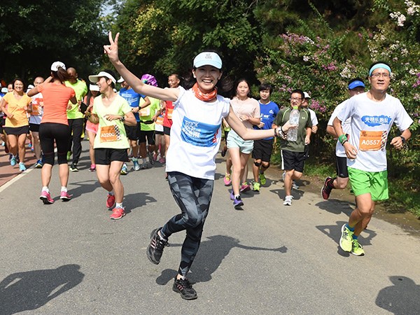 People go jogging at Olympic Forest Park on the north side of Beijing.