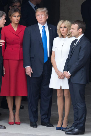 French President Emmanuel Macron (1st R) and his wife Brigitte Macron (2nd R), and U.S. President Donald Trump (3rd R) and his wife Melania Trump, attend a welcome ceremony at the Invalides in Paris, France, on July 13, 2017. (Xinhua/Jack Chan)
