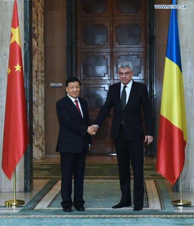 Liu Yunshan (L), a member of the Standing Committee of the Political Bureau of the Central Committee of the Communist Party of China, meets with Romanian Prime Minister Mihai Tudose in Bucharest, Romania, July 13, 2017. (Xinhua/Rao Ainmin )