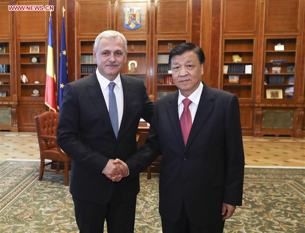 Liu Yunshan (R), a member of the Standing Committee of the Political Bureau of the Communist Party of China (CPC) Central Committee, meets with Liviu Dragnea, chairman of Romania's ruling Social Democratic Party (PSD) and speaker of the Chamber of Deputies, in Bucharest, Romania, July 14, 2017. (Xinhua/Pang Xinglei)