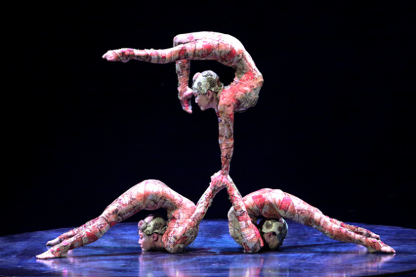 Three contortionists from Mongolia perform in Singapore on Wednesday for Cirque du Soleil's touring show in Asia, which will be introduced to China on Oct 1 in Shanghai. (Photo/China Daily)