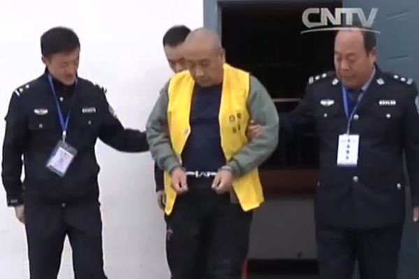 A screen grab shows Gao Chengyong as he is escorted to court in Baiyin, Gansu province.