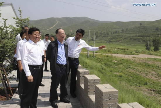 Wang Qishan, secretary of the Communist Party of China (CPC) Central Commission for Discipline Inspection, visits the construction site of venues for the 2022 Winter Olympics in Zhangjiakou, north China's Hebei Province, July 18, 2017. Wang made an inspection to Zhangjiakou on July 18 and 19. (Xinhua/Ding Lin)