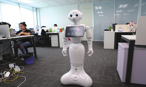 Softbank Robotics's humanoid robot Pepper stands in the company's Shanghai office. (Photo: Chen Qingqing/GT)