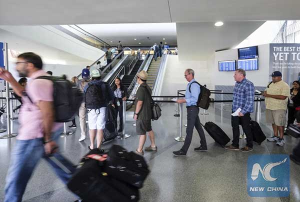 Travelers wait in line at Los Angeles International Airport, the United States, June 30, 2017. Photo/Xinhua