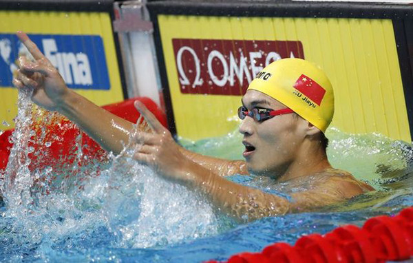 Xu Jiayu of China celebrates after winning the men's 100m backstroke at the 17th FINA World Championships in Budapest, July 25, 2017. (Photo/Agencies)