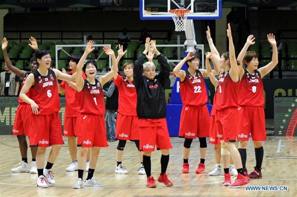 Players of Japan celebrate after winning semi-final of 2017 FIBA Asia Women's Cup against China held at Bangalore, south Indian state of Karnataka on July 28, 2017.(Xinhua)
