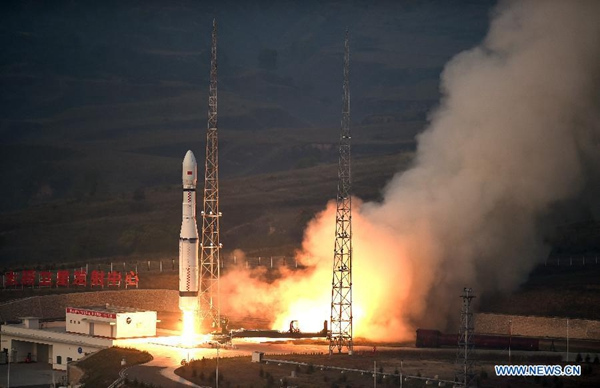 A new model of China's carrier rocket Long March-6 carrying 20 micro-satellites blasts off from the launch pad at 7:01 am from the Taiyuan Satellite Launch Center in north China's Shanxi Province, Sept 20, 2015. The new carrier rocket will be mainly used for the launch of micro-satellites and the 20 micro-satellites will be used for space tests. (Photo/Xinhua)