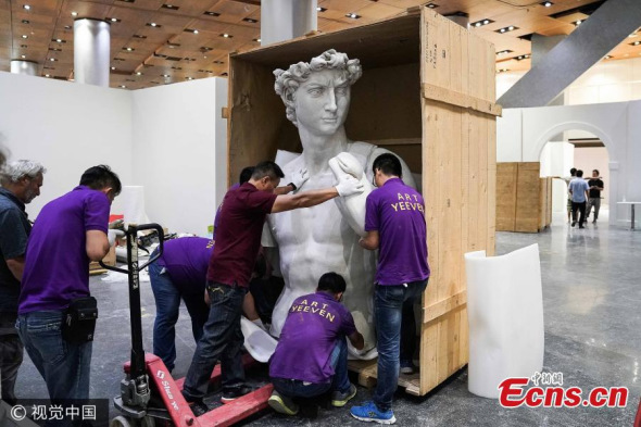 Workers install a copy of Michelangelo's David at Birds Nest Culture Center in Beijing. Michelangelo's David statue has been put together and will be open to the public at the Bird's Nest International Art Exhibition from July 15 to October 10. The full-size replica produced by professor Andrea Chiesi is six meters high. With the support of Casa Buonarroti Museum, the Bird's Nest International Art Exhibition will display 105 art treasures. (Photo/VCG)