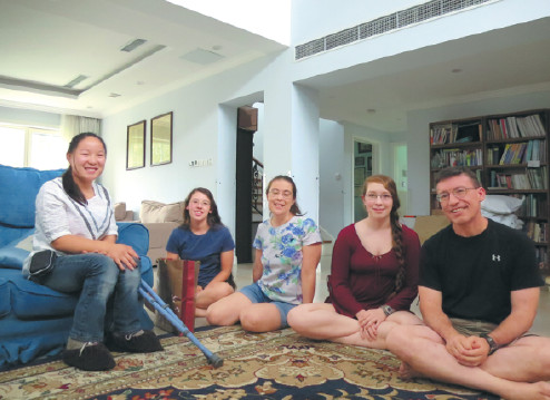 Brent Johnson, his wife (center), his two daughters and Lin Lin, a former foster care child from China who used to live with the Johnson family in the United States.(Photo provided to China Daily)
