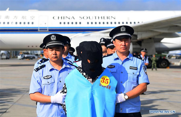 Suspects in telecom and online fraud cases are brought back to China from Fiji at Changchun Longjia International Airport, Changchun, northeast China's Jilin Province, Aug. 5, 2017. A total of 77 suspects in telecom and online fraud cases have been brought back to China from Fiji, the Ministry of Public Security announced Saturday. The suspects are accused in more than 50 cases involving more than 6 million yuan (892,000 U.S. dollars). (Xinhua/Lin Hong)