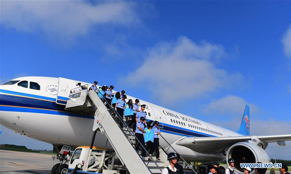 Suspects in telecom and online fraud cases are brought back to China from Fiji at Changchun Longjia International Airport, Changchun, northeast China's Jilin Province, Aug. 5, 2017. A total of 77 suspects in telecom and online fraud cases have been brought back to China from Fiji, the Ministry of Public Security announced Saturday. The suspects are accused in more than 50 cases involving more than 6 million yuan (892,000 U.S. dollars). (Xinhua/Lin Hong)