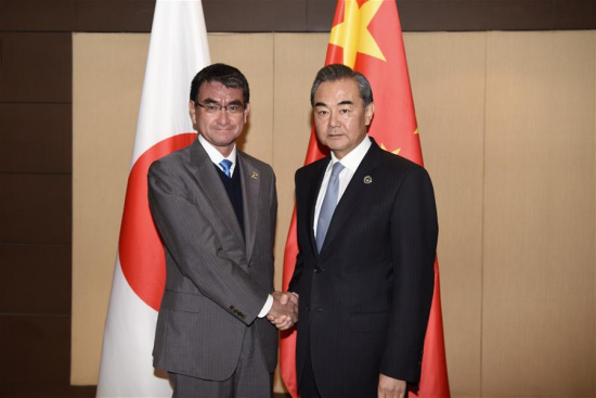 Chinese Foreign Minister Wang Yi (R) meets with Japanese Foreign Minister Taro Kono in Manila, the Philippines, Aug. 7, 2017. Wang Yi on Monday urged Japan walk the talk and put its positive expression of improving ties with China into action. (Xinhua/Wang Shen)