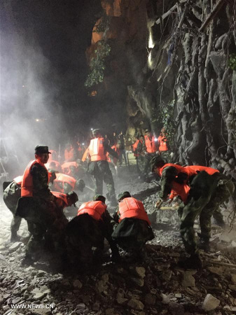 Rescuers work at a quake-hit tourist site in Zhangzha town, Jiuzhaigou County, southwest China's Sichuan Province, Aug. 9, 2017. A 7.0-magnitude earthquake struck a remote area in southwest China's Sichuan Province Tuesday night, leaving at least five people dead and more than 60 injured. (Xinhua/Zheng Lei)