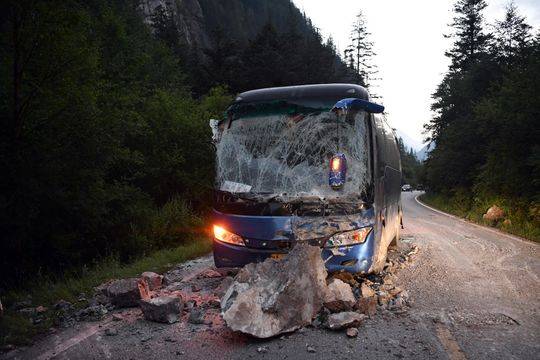 The tourist bus was hit by boulders. (Photo/Xinhua)
