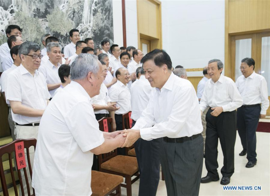 Liu Yunshan, a member of the Standing Committee of the Political Bureau of the Communist Party of China Central Committee, meets with 57 scientists and experts who are enjoying a state-sponsored summer vacation at Beidaihe, a popular northern seaside resort in north China's Hebei Province, Aug. 9, 2017. (Xinhua/Wang Ye)
