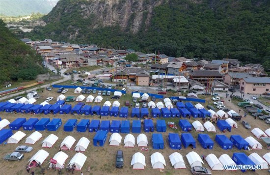 Photo taken on Aug. 11, 2017 shows tents at a temporary shelter in Zhangzha Village of Zhangzha Town in Jiuzhaigou County, southwest China's Sichuan Province, Aug. 11, 2017. (Xinhua/Xue Yubin)