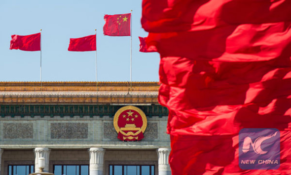 Red flags on the Tian'anmen Square and atop the Great Hall of the People in Beijing. (Photo/Xinhua)