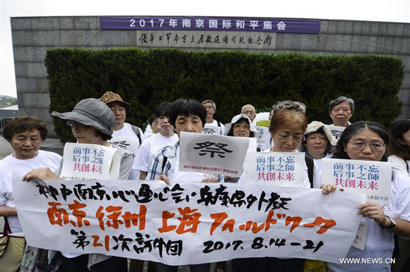 Members of an anti-war NGO based in Kobe, Japan attend a peace assembly at the Memorial Hall of the Victims in Nanjing Massacre by Japanese Invaders in Nanjing, capital of east China's Jiangsu Province, Aug. 15, 2017. (Xinhua/Ji Chunpeng)