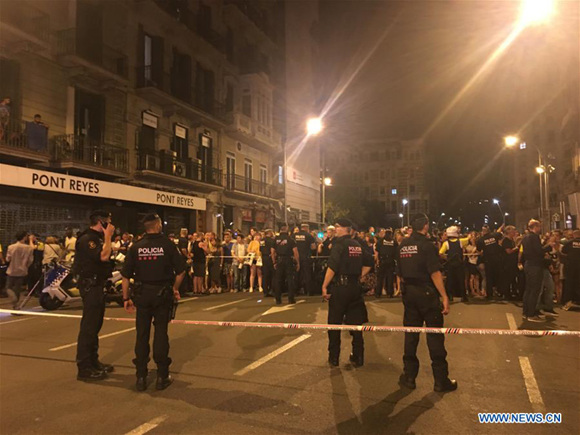 Police cordon off a nearby street following a terrorist attack in central Barcelona, Spain, on Aug. 18, 2017. Thirteen people were confirmed dead and more than 100 others injured, with some of them in very serious condition in Barcelona terror attack on Thursday afternoon, a Spanish official said. (Xinhua/Ying Qiang)