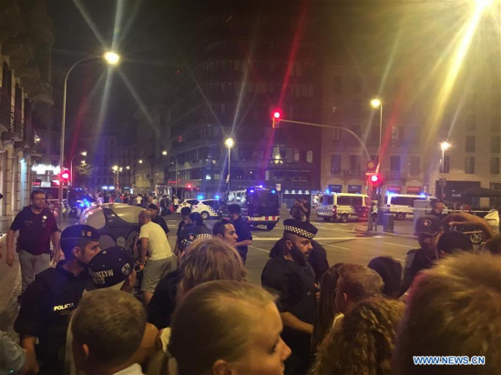 Police cordon off a nearby street following a terrorist attack in central Barcelona, Spain, on Aug. 18, 2017. Thirteen people were confirmed dead and more than 100 others injured, with some of them in very serious condition in Barcelona terror attack on Thursday afternoon, a Spanish official said. (Xinhua/Ying Qiang)