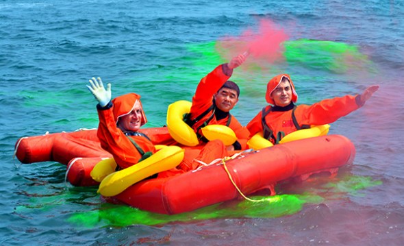 Astronauts Matthias Maurer (left), Liu Boming and Ye Guangfu signal for help in Monday's training. 