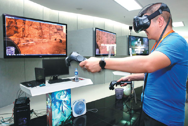 A customer experiences visual reality equipment made by G-bits, a company in Xiamen that focuses on internet game design and development. Jin Liwang / Xinhua