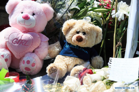 Toy bears are seen to mourn the victims of terror attack on Las Ramblas street, Barcelona, Spain, on Aug. 18, 2017. The number of people killed in Thursday's double terror attacks rose to 14, after a woman died of injuries at the Joan XXIII hospital, the Catalan emergency services confirmed on Friday. (Xinhua/Xu Jinquan)