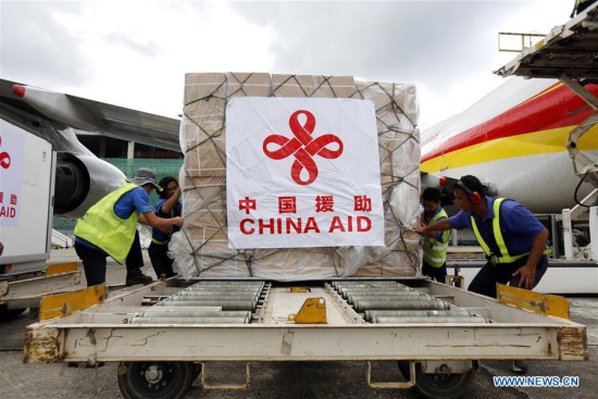 Workers unload China's emergency aid against seasonal influenza A/H1N1 from a plane at the Yangon International Airport in Yangon, Myanmar, Aug. 24, 2017. (Xinhua/U Aung)