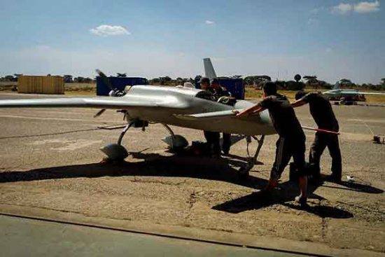 Technicians from the China Academy of Aerospace Aerodynamics prepare a CH-3 unmanned aircraft for a prospecting flight in Zambia. CHINA DAILY