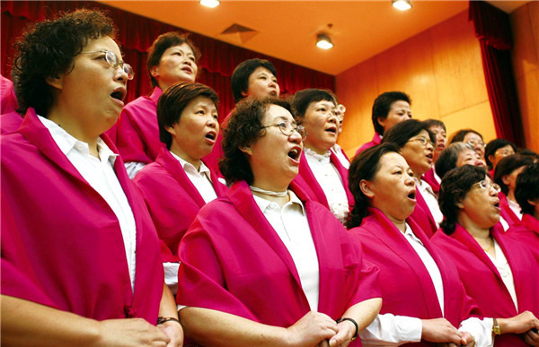 Members of the Yankang Center perform at a song contest. Photo provided to CHINA DAILY