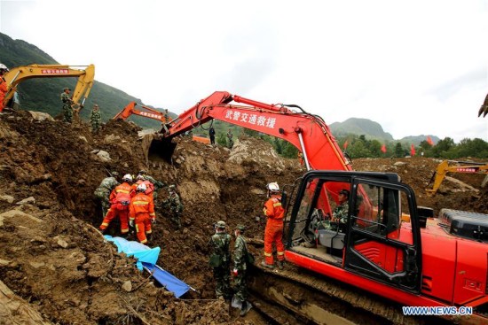 Rescuers use machinery to search for missing people at the site of a landslide in Nayong County in southwest China's Guizhou Province Aug. 30, 2017. The death toll from a landslide in southwest China's Guizhou Province Monday morning has risen to 23, with 12 still missing, rescuers said Wednesday. (Xinhua/Xue Zhenming)