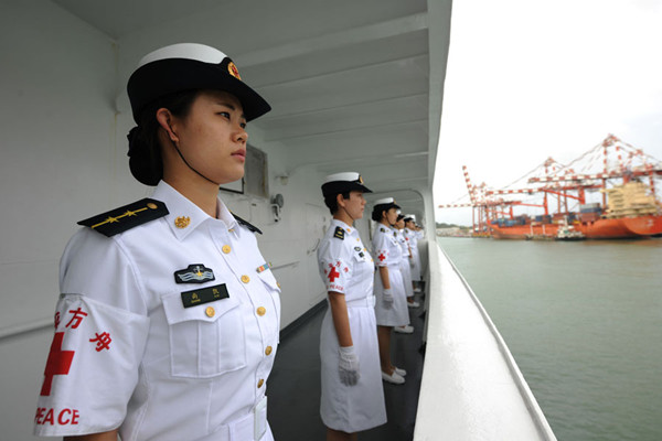 The crew of the hospital ship Peace Ark lines up on the board on Aug 6, 2017. Photo/Xinhua